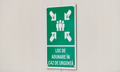 Emergency assembly point in Romanian language (loc adunare caz de urgenta) sign on a construction site