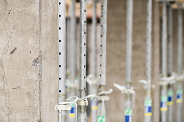 Construction details. Building the resistance poles of a residential flat construction. Details of the metal from the concrete. Construction industry.