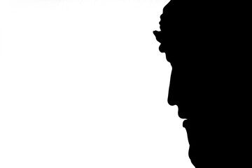 Silhouette of face of Jesus Christ in a crown on white background. Copy space.