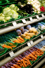 Fresh and ready to eat. Shelving in a grocery store filled with fresh produce.