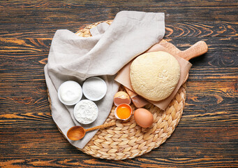 Composition with ingredients for preparing lazy dumplings on wooden background
