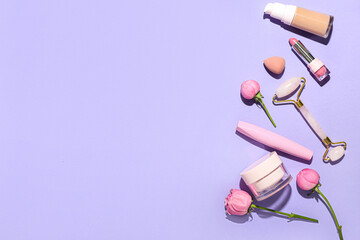 Cosmetics, facial massage tool and rose flowers on lilac background
