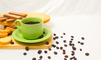 Black coffee and biscuits on a white background.