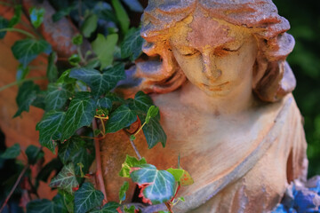 Beautiful guardian angel. Fragment of an ancient statue