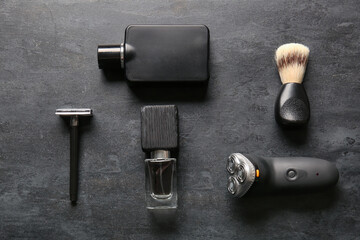 Stylish male accessories for shaving on black background