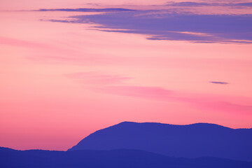 Fototapeta na wymiar Sunrise pastel colors and mountains, beautiful sky