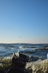 Waves on the sea. Sea water drops. Water splash