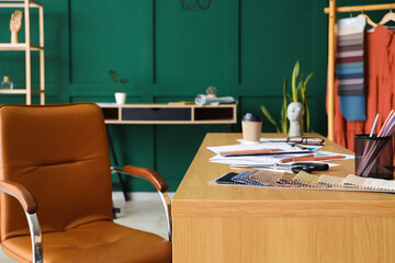 Workplace of clothes stylist in studio