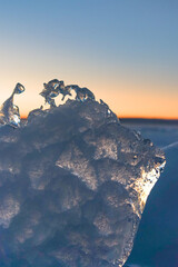 Ice against winter sunset