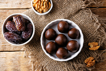 Dates walnuts chocolate raw balls in a plate