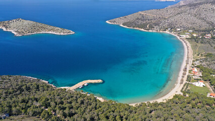 Fototapeta na wymiar Aerial drone photo of Kanakia beach with crystal clear turquoise sea ideal for quiet vacation close to Athens, Salamina island, Saronic Gulf, Greece