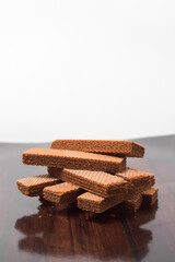 Pile of delicious chocolate wafers, on white background.