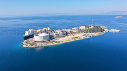 Aerial drone photo of LNG (Liquified Natural Gas) tanker anchored in small LNG industrial islet of...