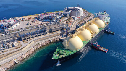 Aerial drone photo of LNG (Liquified Natural Gas) tanker anchored in small gas terminal island with...