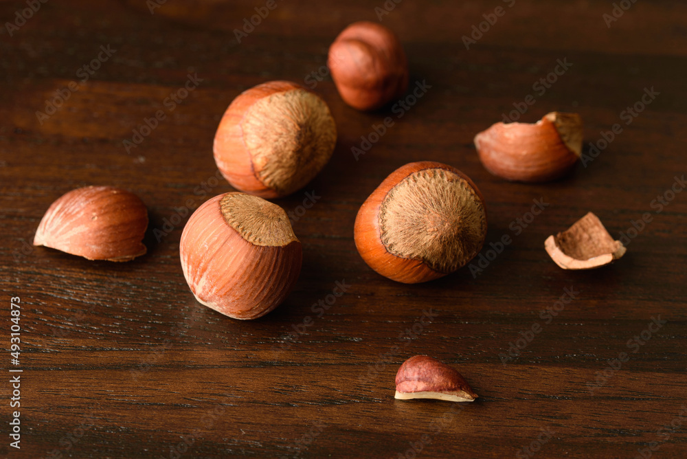 Poster hazelnut nuts healthy food on wood background,nutshell hazel 