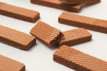 Pile of delicious chocolate wafers, on white background.