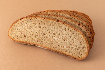 Slices of bread on a brown background.