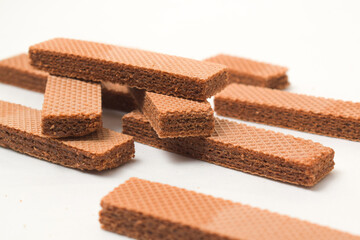 Pile of delicious chocolate wafers, on white background.