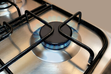 Close up of a gas stove blue flame, Household gas burner flame, used in the home for heating, water...