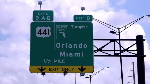 Street sign on the highway of Florida showing Miami and Orlando - travel photography