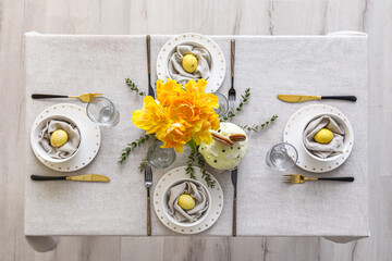 Table with beautiful setting served for Easter celebration