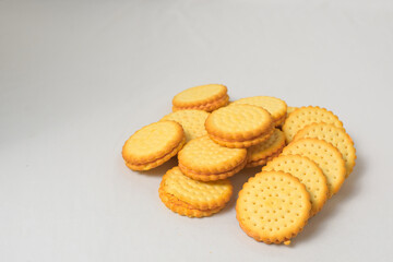 Cheese-flavored biscuits, photo from the top corner, isolated on a white background