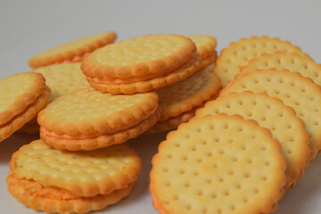 Cheese-flavored biscuits, photo from the top corner, isolated on a white background