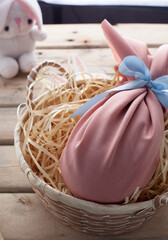 homemade easter egg in a pink cloth wrapper