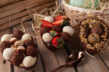 
homemade easter egg with chocolate, strawberry, brigadeiro and nest milk