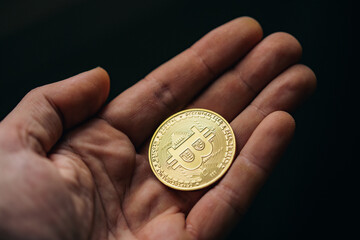 Fototapeta premium Silver bitcoin cryptocurrency in a hand