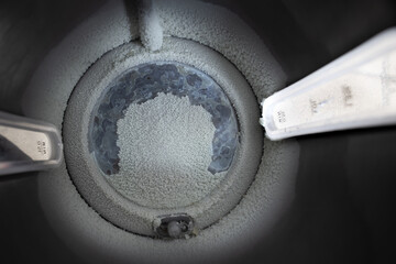 vertical view inside a kettle of limescale in a kettle