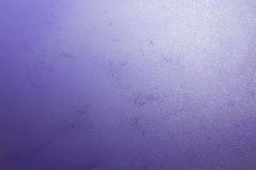 Dark blue background with yellow golden defocused lights. Festive Christmas background. Blurred violet very peri background. Purple copy space background