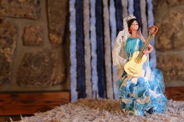Traditional flamenco dancer doll holding Spanish guitar