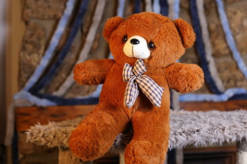 Brown teddy bear with cool bow tie 