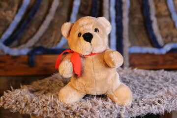 Brown teddy bear with cool bow tie