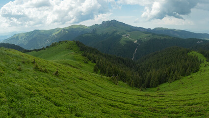 Obraz premium Rainy, stormy atmosphere on the high altitude pastures of Ciucas Mountains. The mountain crests are covered with heavy rain. Carpathia, Romania.