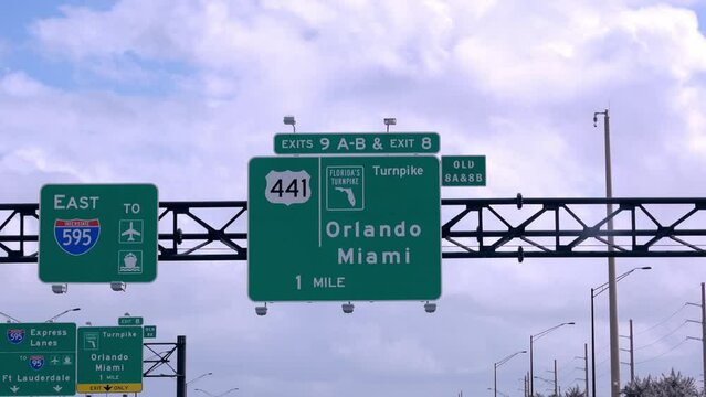 Street sign on the highway of Florida showing Miami and Orlando - travel photography