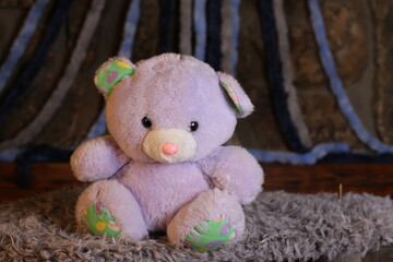 Purple teddy bear with cool bow tie