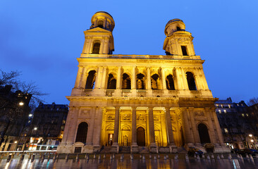 The famous church of Saint Sulpice at rainy night , Paris, France.