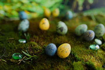 Easter colored eggs on green grass with blurred background
