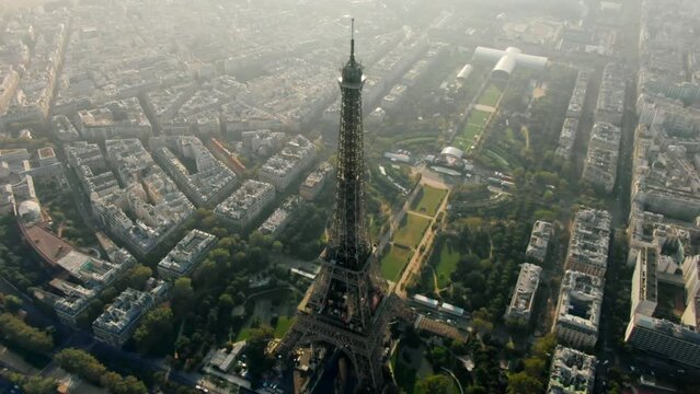 Aerial Panorama of Paris Cityscape with Eiffel Tower on Champ de Mars and Seine River. Landmark French Monument in Historic City Center. Most Visited Travel European City. 4K drone top down orbit shot
