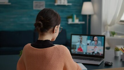 Female student talking on online class video call to study from home, attending teleconference meeting on webcam. Young woman learning knowledge on videoconference call discussion. - Powered by Adobe