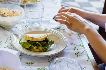 arepa served in a white porcelain plate on a table