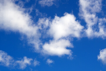 Fototapeta premium Beautiful blue sky with white clouds.Nature background with clear blue sky and fluffy clouds