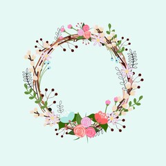 Beautiful spring wreath with flowers, leaves, berries and willow branches. 