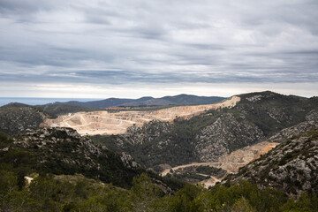 Fototapeta na wymiar Cement mining quarry in park Garraf, Catalonia, Spain