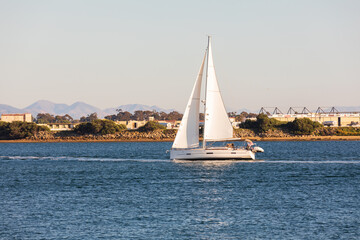 Sailboat across blue water