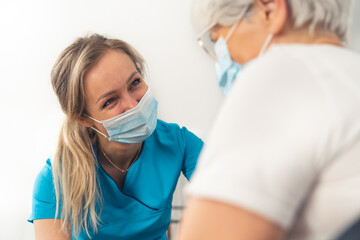 Caucasian caregiver woman with senior pensioner lady. Support from healthcare workers. . High...