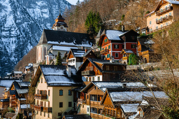 Snow-coated houses in the quiet, enchanting village of Hallstatt 