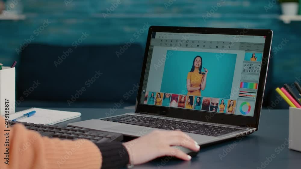 Poster photography student editing picture on retouching software, working on laptop for online design prod
